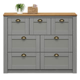 IDIMEX Commode Chambre Bolton L 110 cm en Bois Massif Gris et Brun 7 tiroirs Meuble de Rangement Adulte Buffet Pratique Style Campagne Classique avec Poignets Coquille en métal Coloris Bronze