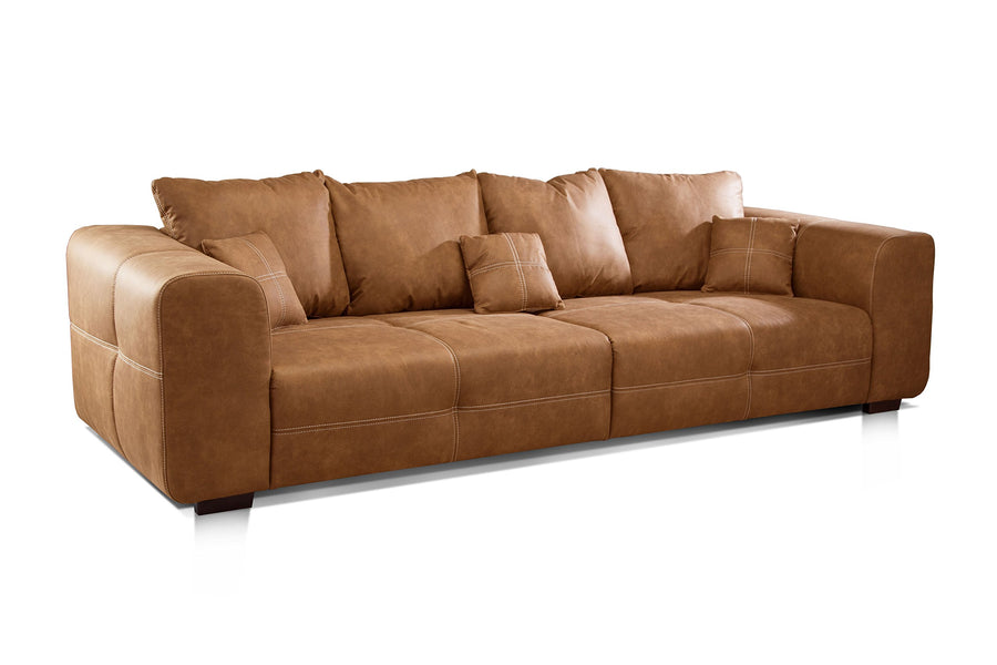 CAVADORE Big Sofa Mavericco Canapé rembourré, Taille XXL, Aspect Cuir, avec Coussin de Dossier et Coussin décoratif, 287 x 69 x 108 cm (l x H x P), en Microfibre, Cognac