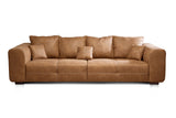 CAVADORE Big Sofa Mavericco Canapé rembourré, Taille XXL, Aspect Cuir, avec Coussin de Dossier et Coussin décoratif, 287 x 69 x 108 cm (l x H x P), en Microfibre, Cognac