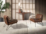 Angel Cerdá – Fauteuil Design Tapissé en Cuir Marron Cognac | Design Enveloppant et Confortable | Pieds en Acier Inoxydable Poli | Design Moderne pour Salon | 85 x 90 x 85 cm